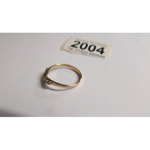 2004 - An 18ct yellow gold emerald and diamond wishbone ring, size Q.