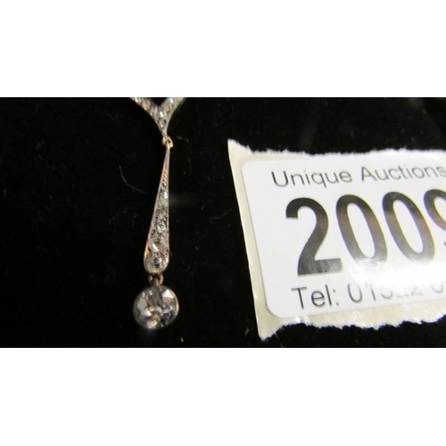 2009 - A stylish designer 18ct white gold and diamond necklace with diamond drops.