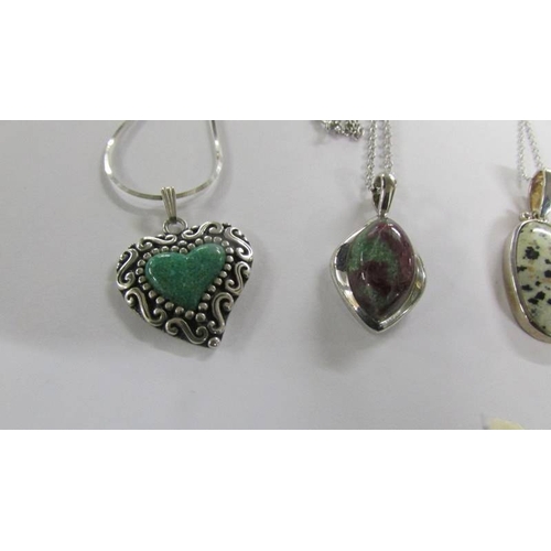 2016 - 6 assorted silver pendants.