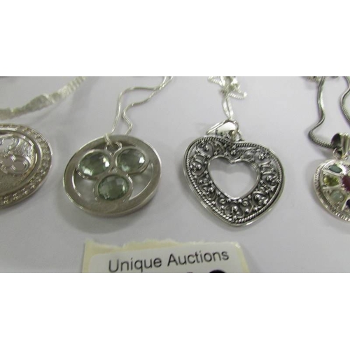 2018 - 6 assorted silver pendants.