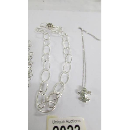 2023 - 2 silver necklaces and a silver pendant.