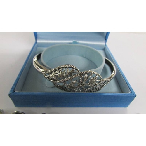 2025 - A silver bangle and 3 silver bracelets.