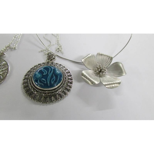 2026 - 6 assorted silver pendants.