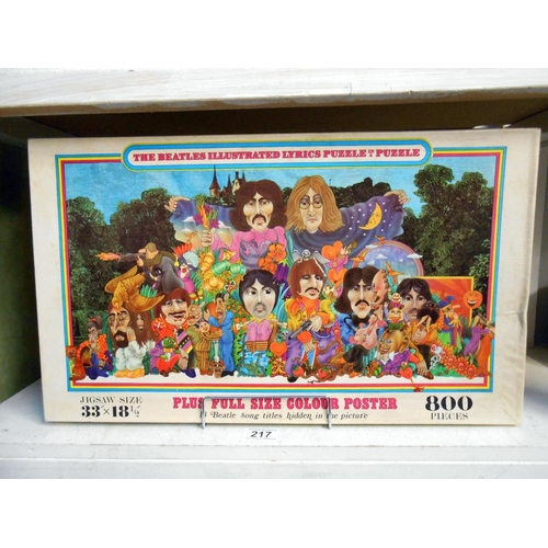 217 - A vintage Beatles jigsaw puzzle with poster and answers, unchecked for completion