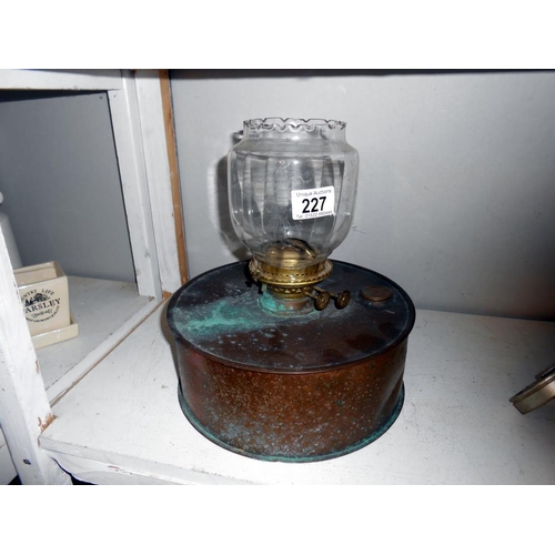 227 - An unusual copper oil lamp with shade