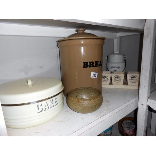 222 - A large lidded stoneware bread bin, Ringtons porcelain lidded pot, cake tin (bottom a/f) etc.