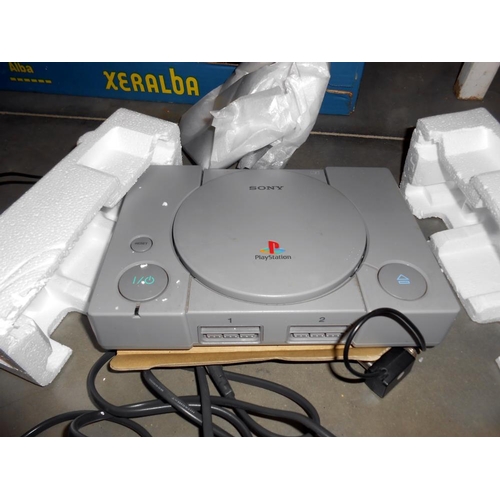 230 - A large quantity of 80/90's Playstation console, controls, games etc