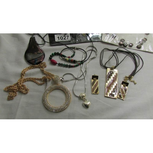 1027 - A mixed lot of costume jewellery including necklaces, bracelets, earrings etc.,