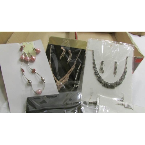 1027 - A mixed lot of costume jewellery including necklaces, bracelets, earrings etc.,