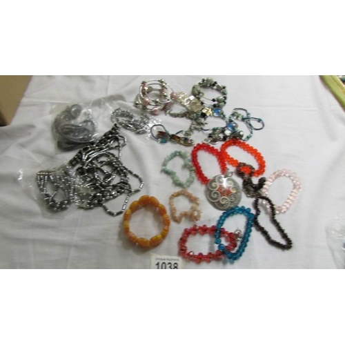 1038 - A grey necklace, bracelet and earrings, a similar set in black and six assorted bangles and bracelet... 