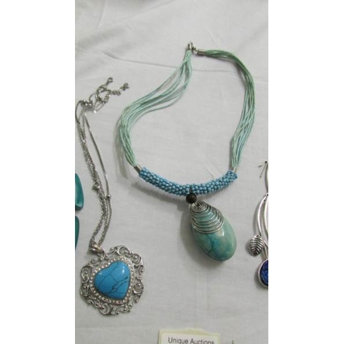 1039 - A white metal leaf necklace set blue stones and 3 turquoise coloured necklaces.