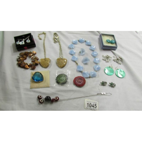 1045 - A mixed lot of pendants, necklaces and earrings.