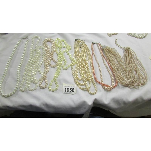 1056 - A mixed lot of pearl and other necklaces.