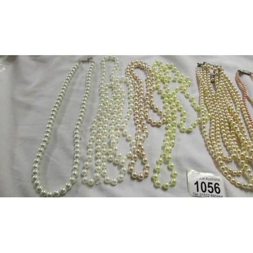 1056 - A mixed lot of pearl and other necklaces.