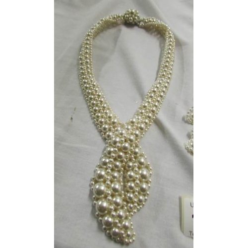 1058 - Two pearl coloured chokers.