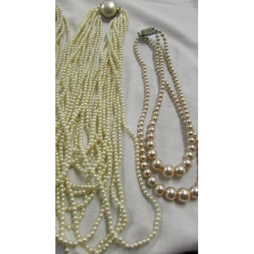 1059 - Five multi strand 'pearl' necklaces,