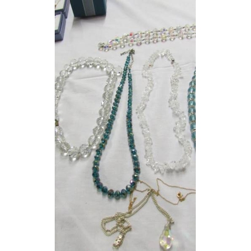 1064 - 7 crystal necklaces and 2 pendants.