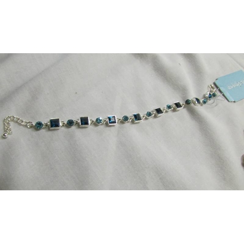 1071 - A good quality necklace and bracelet with amethyst coloured stones and a bracelet with blue stones.