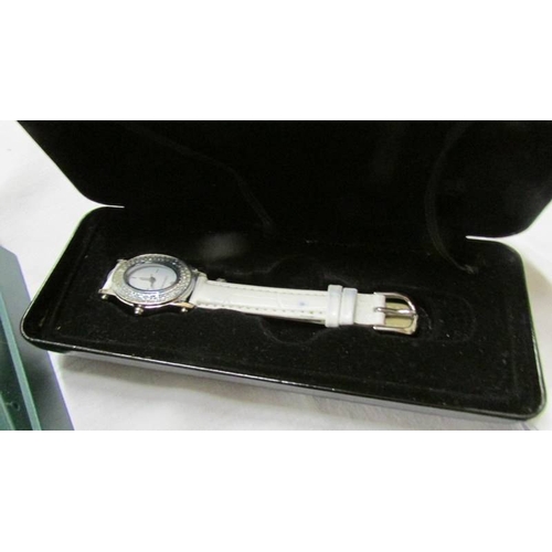 1072 - A Cabouchon diamond watch with spare straps and certificate, an Avia watch, a Limit watch and a nurs... 