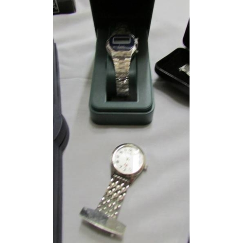 1072 - A Cabouchon diamond watch with spare straps and certificate, an Avia watch, a Limit watch and a nurs... 