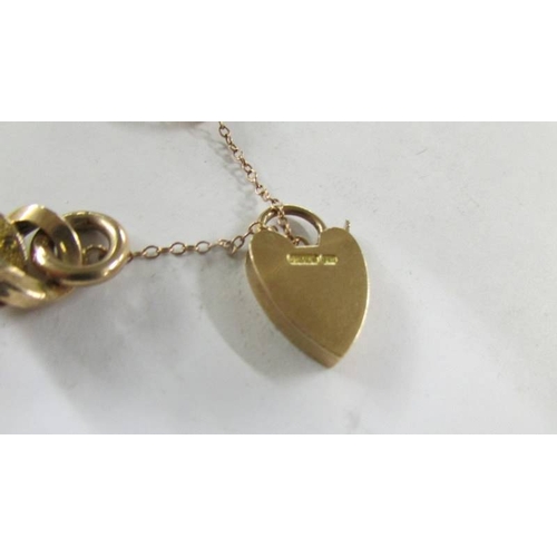 2053 - A 9ct gold chain with 9ct gold padlock, 20.3 grams.