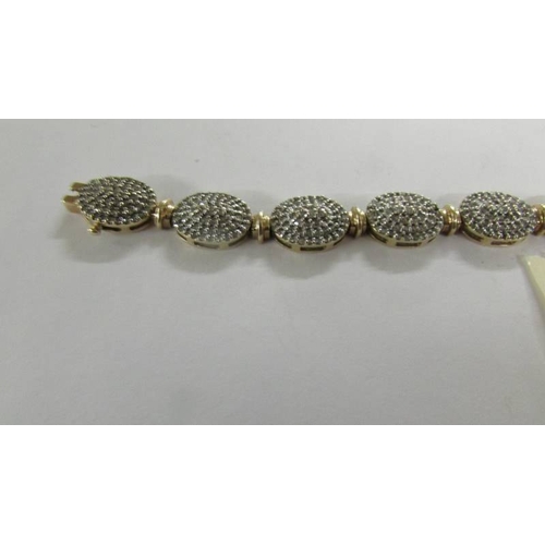 2059 - A 9ct gold and diamond bracelet (missing some diamonds).