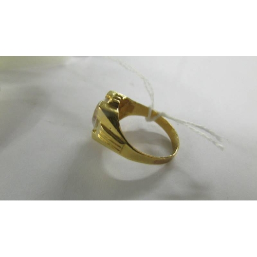 2064 - A ring set white stone, size S. (tests as 18ct gold).