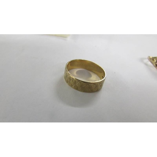 2069 - A 9ct gold wedding ring and a 9ct gold heart ring, 5.2 grams.