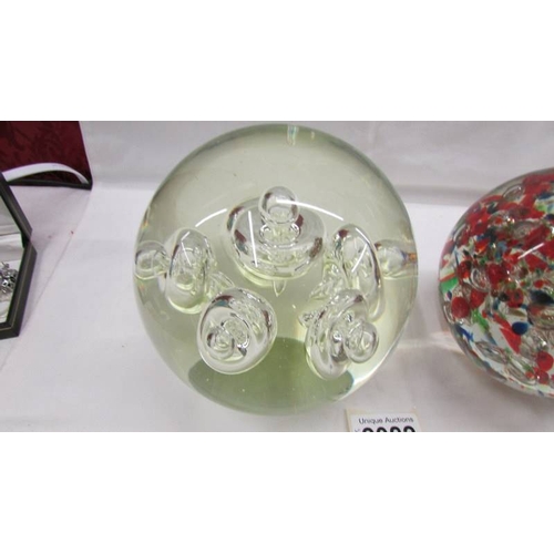 2082 - A large heavy opaque glass paperweight together with a large heavy multicoloured glass paperweight, ... 