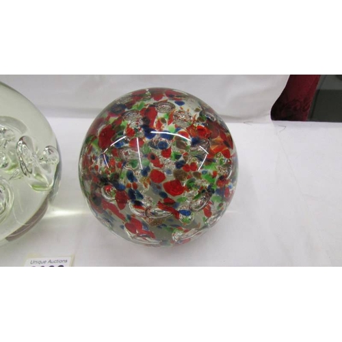 2082 - A large heavy opaque glass paperweight together with a large heavy multicoloured glass paperweight, ... 