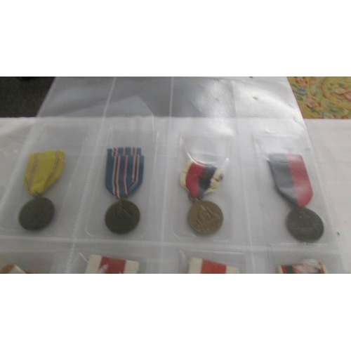 2162 - Approximately 20 military and other medals with ribbons, (mainly restrikes).