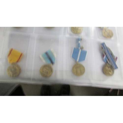 2162 - Approximately 20 military and other medals with ribbons, (mainly restrikes).