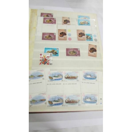 2164 - An album of German postage stamps and three other albums of stamps including Hong Kong, Tuvalu, USA,... 