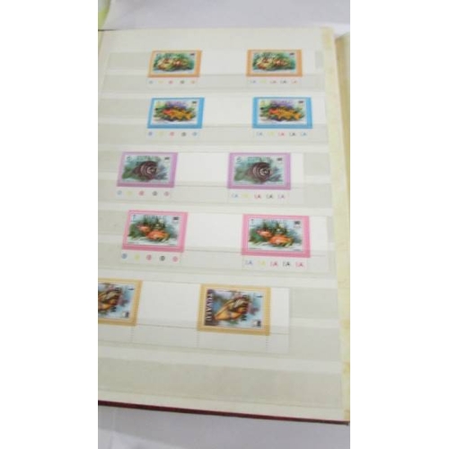 2164 - An album of German postage stamps and three other albums of stamps including Hong Kong, Tuvalu, USA,... 