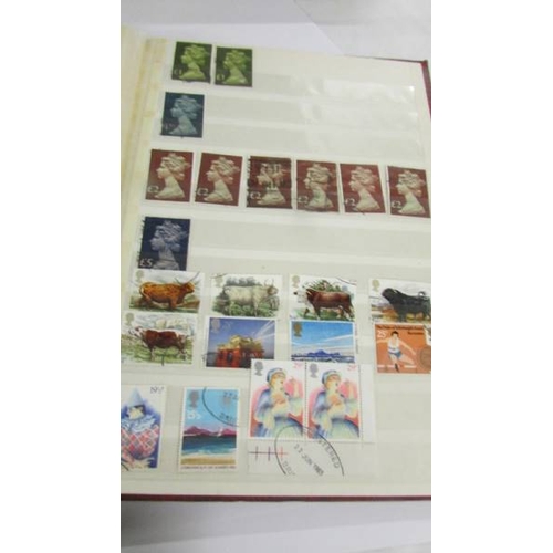 2164 - An album of German postage stamps and three other albums of stamps including Hong Kong, Tuvalu, USA,... 