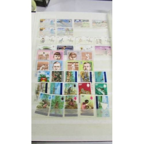 2164 - An album of German postage stamps and three other albums of stamps including Hong Kong, Tuvalu, USA,... 