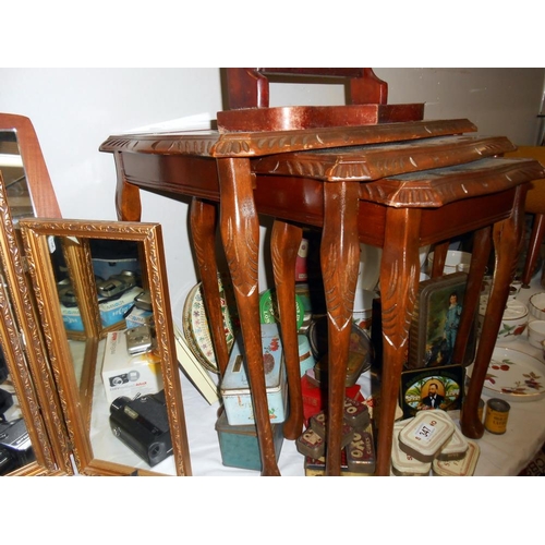 346 - A darkwood nest of tables with green leather inset and glass tops, Height 53.5cm