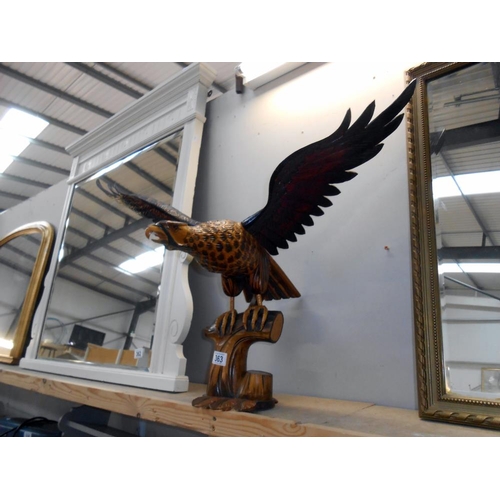 363 - A large wooden figure of an eagle (wings detach as well as base) The bottom has a few minor nibble b... 