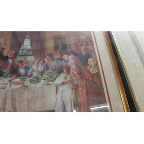 1079 - A framed and glazed print of a family at afternoon tea.