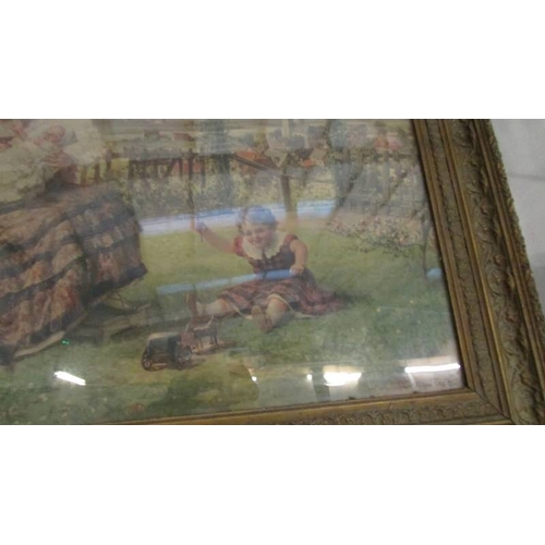 1081 - A framed and glazed garden scene depicting a family.