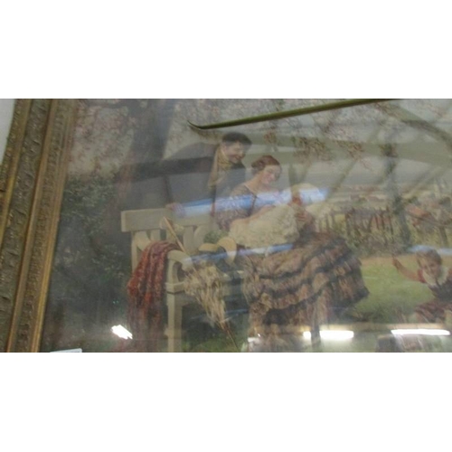 1081 - A framed and glazed garden scene depicting a family.