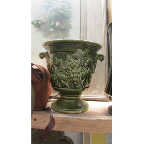 1087 - A green pottery jug, jardiniere and vase.