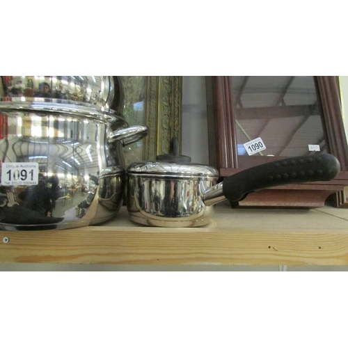 1091 - A set of four good quality stainless steel saucepans and four other stainless steel sauce pans.