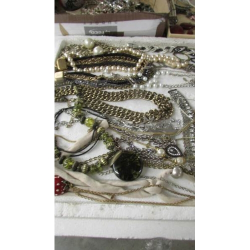 2093 - A large selection of necklaces, some Egyptian design, and various other costume jewellery including ... 