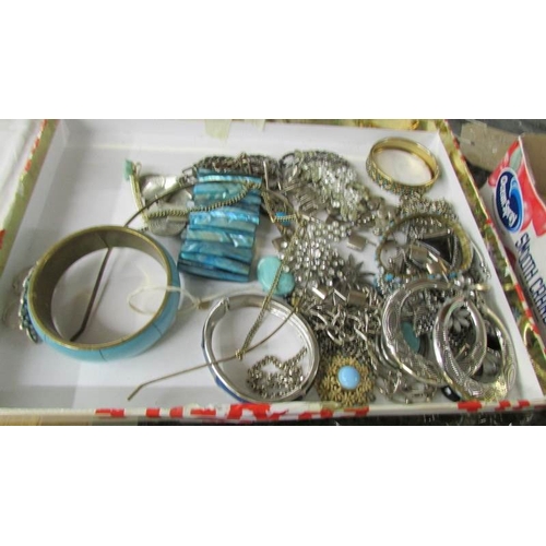 2095 - A large selection of silver coloured metal costume jewellery including rings, cuffs, bangles, neckla... 