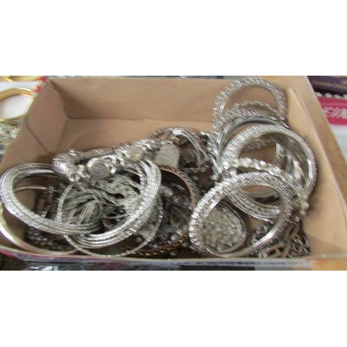 2095 - A large selection of silver coloured metal costume jewellery including rings, cuffs, bangles, neckla... 