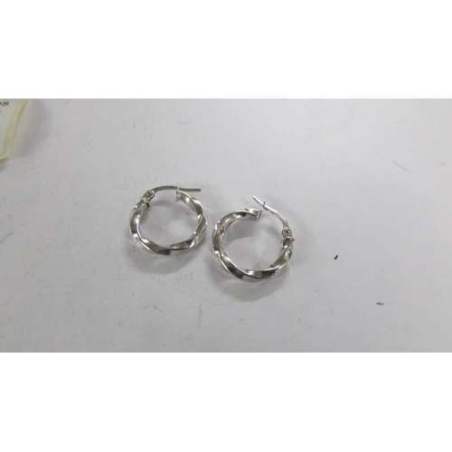 2105 - Two pairs of 9ct white cold hoop earings.