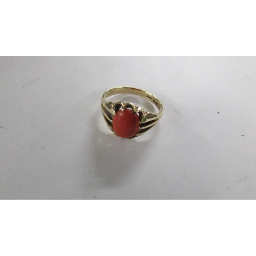 2106 - An early 20th century coral gentleman's ring, stamped 9ct, size T.