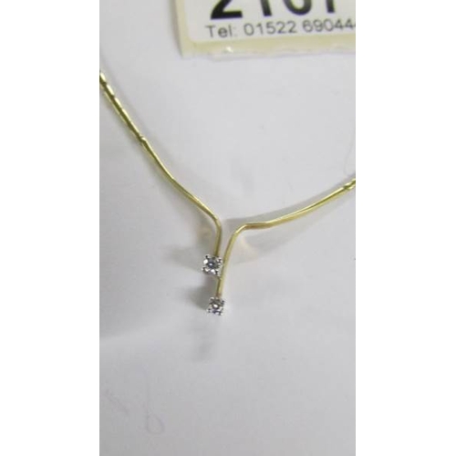 2107 - A diamond 2 stone pendant necklace in 9ct gold.