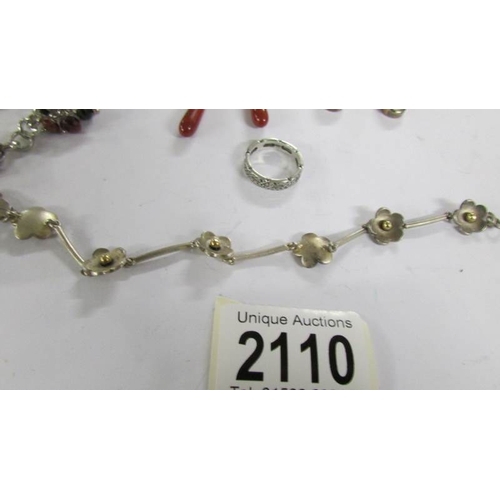 2110 - A quantity of silver jewellery being pendant earrings, bracelet designed as daisies, stone set brace... 